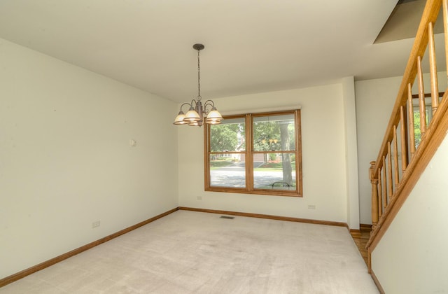 1268 Country Glen Ln, Carol Stream, IL 60188 - spare room with stairway, a chandelier, and light carpet