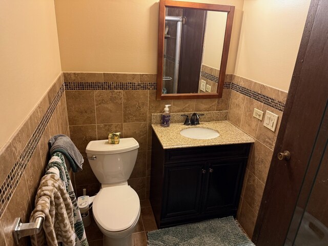 443 Commanche Trl, Wheeling, IL 60090 - bathroom with tile walls, vanity, and a wainscoted wall