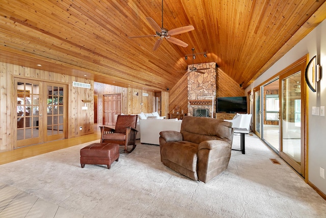 998 N Westshore Blvd, Manteno, IL 60950 - carpeted living area with a ceiling fan, wood walls, lofted ceiling, wooden ceiling, and french doors