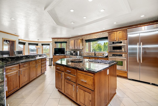 998 N Westshore Blvd, Manteno, IL 60950 - kitchen with appliances with stainless steel finishes, recessed lighting, brown cabinetry, tasteful backsplash, and crown molding