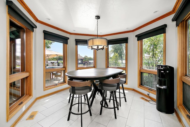 998 N Westshore Blvd, Manteno, IL 60950 - dining room featuring light tile patterned floors, crown molding, and a chandelier