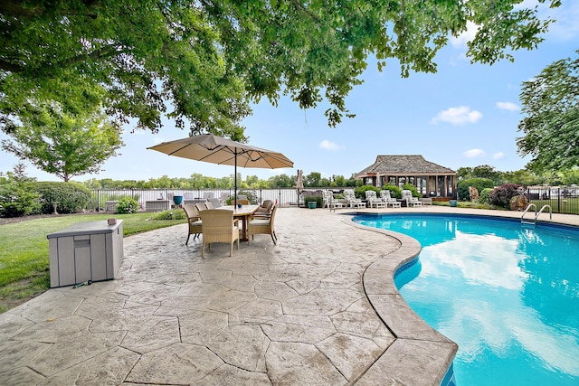 998 N Westshore Blvd, Manteno, IL 60950 - view of pool with a fenced backyard, a patio area, outdoor dining area, and an outdoor structure