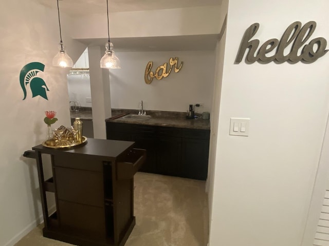 348 Bloomfield Cir, Bloomingdale, IL 60108 - kitchen featuring dark countertops, pendant lighting, carpet floors, dark cabinets, and a breakfast bar