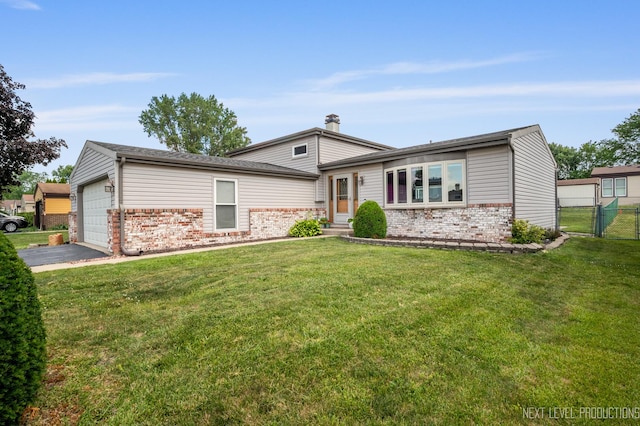 933 Saginaw Ct, Carol Stream, IL 60188 - split level home with brick siding, a garage, and driveway