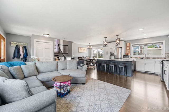 933 Saginaw Ct, Carol Stream, IL 60188 - living room featuring plenty of natural light, a chandelier, stairs, recessed lighting, and wood finished floors