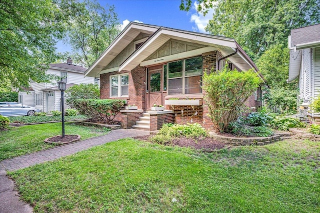 217 S Florence Ave, Bloomington, IL 61701 - view of front of home with brick siding and a front lawn