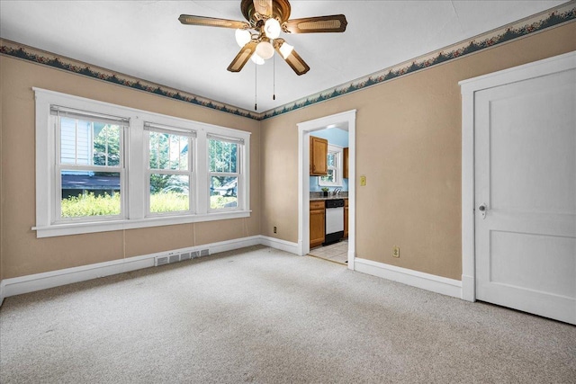 217 S Florence Ave, Bloomington, IL 61701 - spare room featuring light colored carpet and a ceiling fan