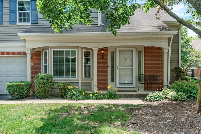 223 New Bridge Ct, Palatine, IL 60067 - view of front of house with brick siding, covered porch, and a garage