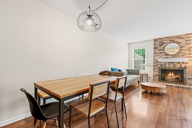 223 New Bridge Ct, Palatine, IL 60067 - dining room featuring wood finished floors and a fireplace