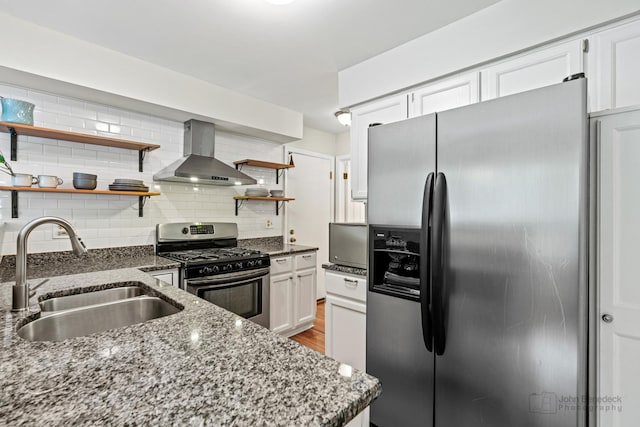 223 New Bridge Ct, Palatine, IL 60067 - kitchen with appliances with stainless steel finishes, wall chimney range hood, open shelves, dark stone counters, and white cabinets