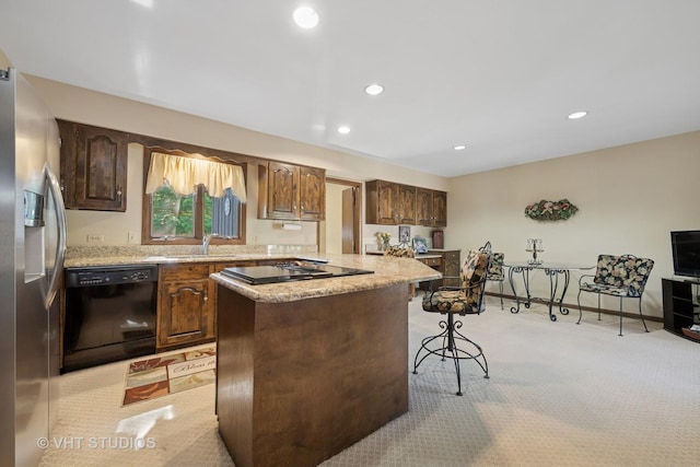 104 Lois Ln, Deer Park, IL 60010 - kitchen featuring black appliances, light colored carpet, a center island, a breakfast bar area, and recessed lighting