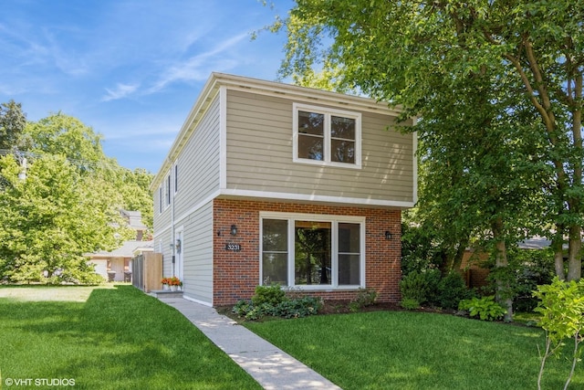 3231 Central St, Evanston, IL 60201 - view of front of house featuring brick siding and a front lawn