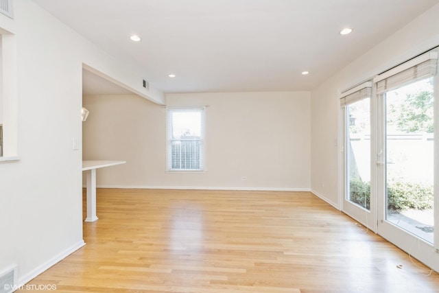 3231 Central St, Evanston, IL 60201 - unfurnished living room featuring healthy amount of natural light, light wood-style floors, and recessed lighting