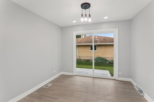 7701 Sawyer Rd, Darien, IL 60561 - unfurnished dining area with recessed lighting, a chandelier, and wood finished floors