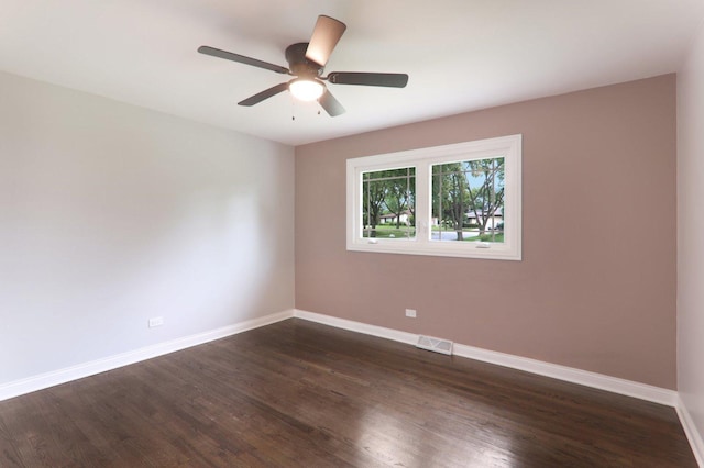 7701 Sawyer Rd, Darien, IL 60561 - spare room featuring dark wood-type flooring and ceiling fan