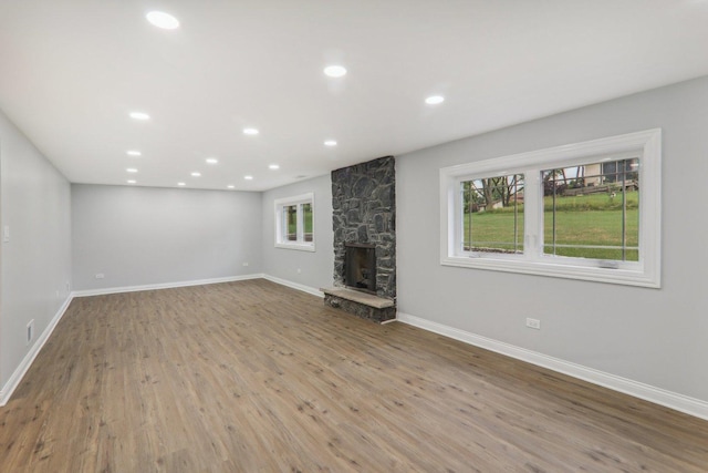 7701 Sawyer Rd, Darien, IL 60561 - unfurnished living room with wood finished floors, a fireplace, and recessed lighting