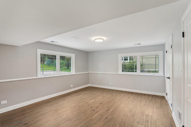 7701 Sawyer Rd, Darien, IL 60561 - empty room featuring wood finished floors and plenty of natural light