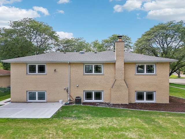 7701 Sawyer Rd, Darien, IL 60561 - back of property with a patio, brick siding, a lawn, and a chimney