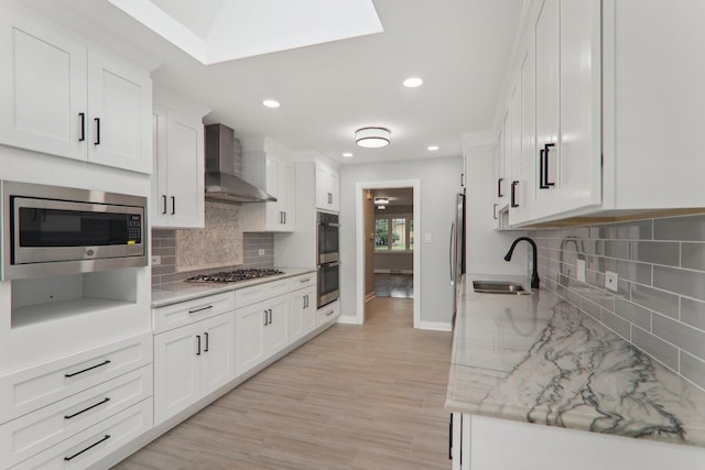 7701 Sawyer Rd, Darien, IL 60561 - kitchen featuring wall chimney exhaust hood, appliances with stainless steel finishes, tasteful backsplash, recessed lighting, and white cabinets
