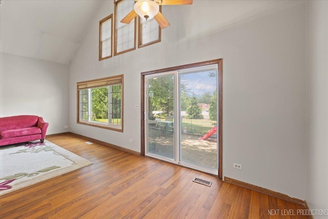 27W414 Melrose Ln, Winfield, IL 60190 - living area with high vaulted ceiling, ceiling fan, and wood finished floors