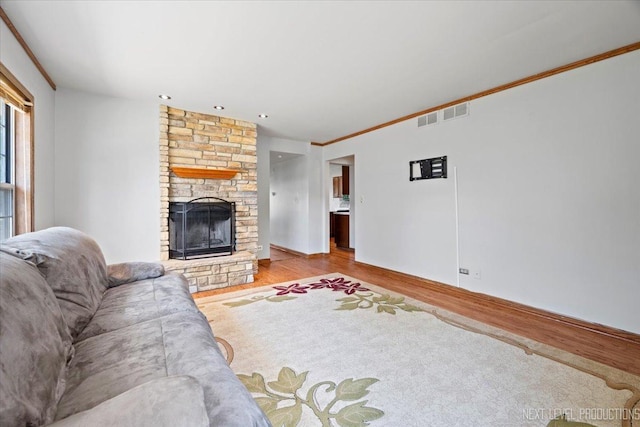 27W414 Melrose Ln, Winfield, IL 60190 - living area with wood finished floors, a fireplace, ornamental molding, and recessed lighting