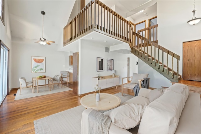 27W414 Melrose Ln, Winfield, IL 60190 - living area with a high ceiling, wood finished floors, stairs, and ceiling fan
