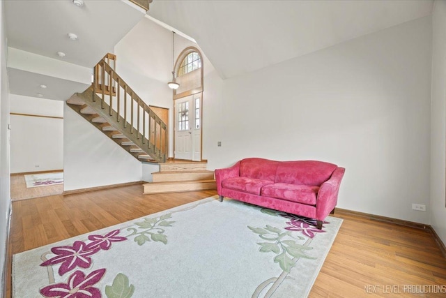 27W414 Melrose Ln, Winfield, IL 60190 - living area with stairway, wood finished floors, and a towering ceiling