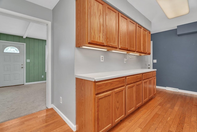 25034 S Center St, Channahon, IL 60410 - kitchen with light countertops, beam ceiling, and light wood-style floors
