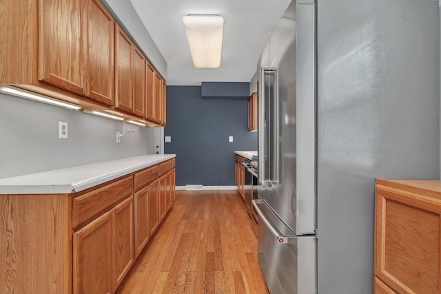 25034 S Center St, Channahon, IL 60410 - kitchen with high end refrigerator, light wood-style flooring, light countertops, and brown cabinetry