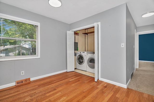 25034 S Center St, Channahon, IL 60410 - laundry room with washing machine and clothes dryer and light wood-style flooring