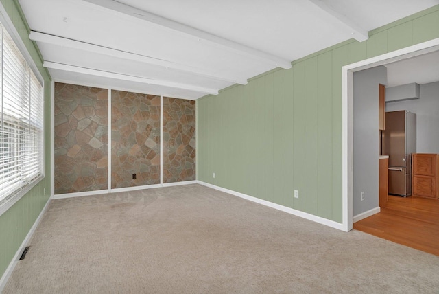 25034 S Center St, Channahon, IL 60410 - spare room with beam ceiling, carpet flooring, and plenty of natural light