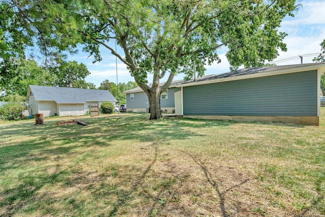 25034 S Center St, Channahon, IL 60410 - view of green lawn with a garage