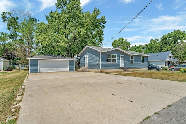 25034 S Center St, Channahon, IL 60410 - view of front facade featuring an outdoor structure, a detached garage, and a front yard