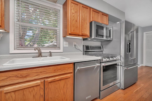 25034 S Center St, Channahon, IL 60410 - kitchen with stainless steel appliances, light wood-type flooring, and light countertops