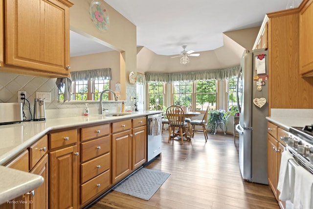 3710 W Nettle Creek Dr, Morris, IL 60450 - kitchen with appliances with stainless steel finishes, ceiling fan, tasteful backsplash, wood finished floors, and light countertops
