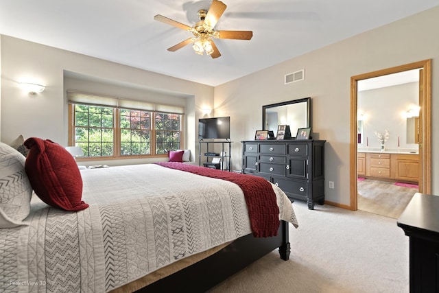 3710 W Nettle Creek Dr, Morris, IL 60450 - bedroom featuring light colored carpet, connected bathroom, and a ceiling fan