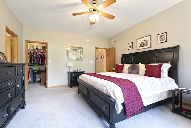 3710 W Nettle Creek Dr, Morris, IL 60450 - bedroom with light carpet, a walk in closet, a closet, and ceiling fan