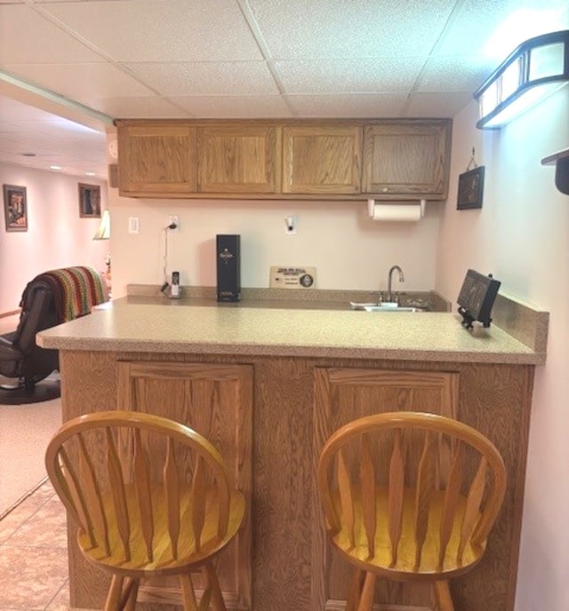 3710 W Nettle Creek Dr, Morris, IL 60450 - indoor wet bar with a paneled ceiling and light tile patterned floors