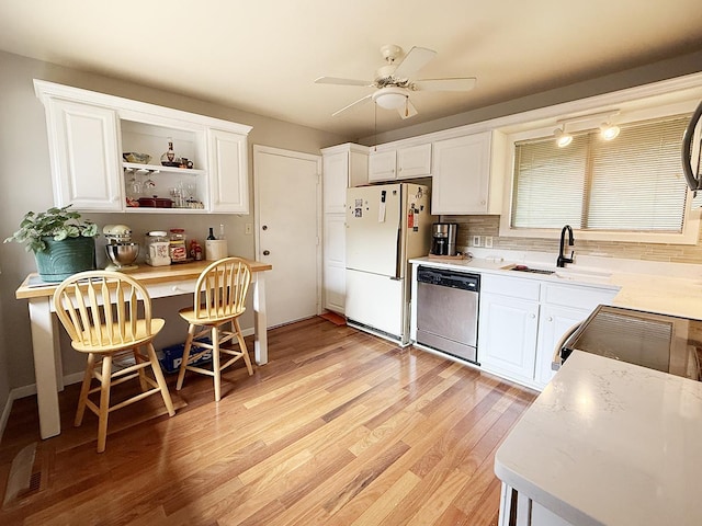 42W396 Hawthorne Ct, Saint Charles, IL 60175 - kitchen featuring dishwasher, freestanding refrigerator, range, white cabinets, and light wood finished floors