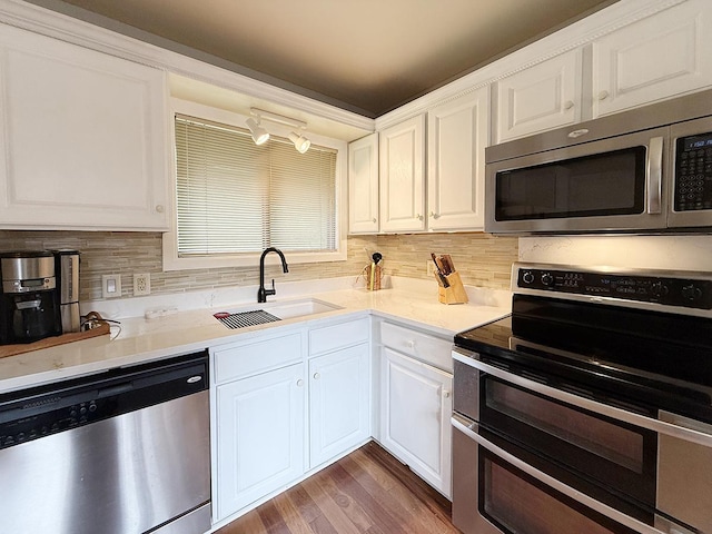 42W396 Hawthorne Ct, Saint Charles, IL 60175 - kitchen featuring appliances with stainless steel finishes, white cabinets, and backsplash