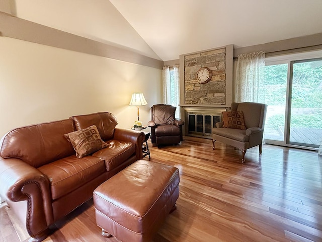 42W396 Hawthorne Ct, Saint Charles, IL 60175 - living room featuring plenty of natural light, lofted ceiling, hardwood / wood-style floors, and a fireplace