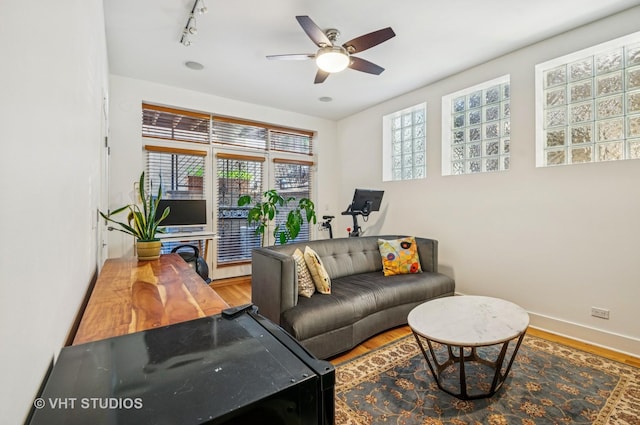 2145 W Crystal St Unit 2, Chicago, IL 60622 - living room featuring healthy amount of natural light, a ceiling fan, wood finished floors, and rail lighting