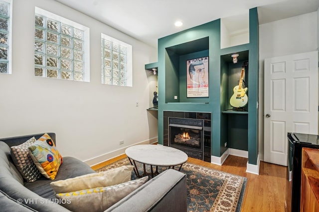 2145 W Crystal St Unit 2, Chicago, IL 60622 - living area with a tile fireplace, wood finished floors, and recessed lighting