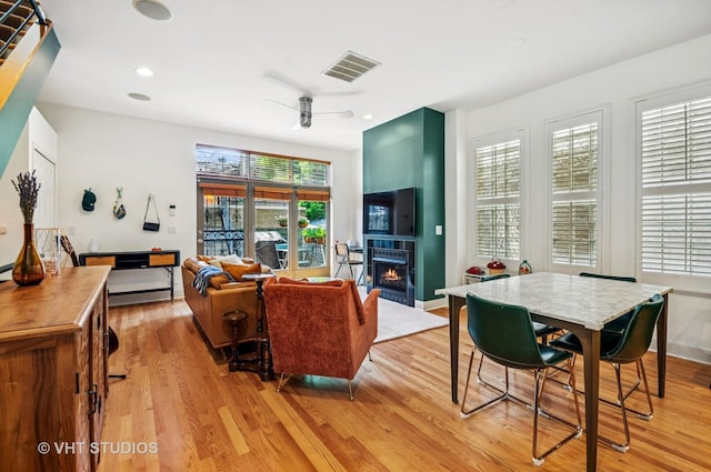 2145 W Crystal St Unit 2, Chicago, IL 60622 - living room featuring ceiling fan, light wood-style floors, a lit fireplace, and recessed lighting