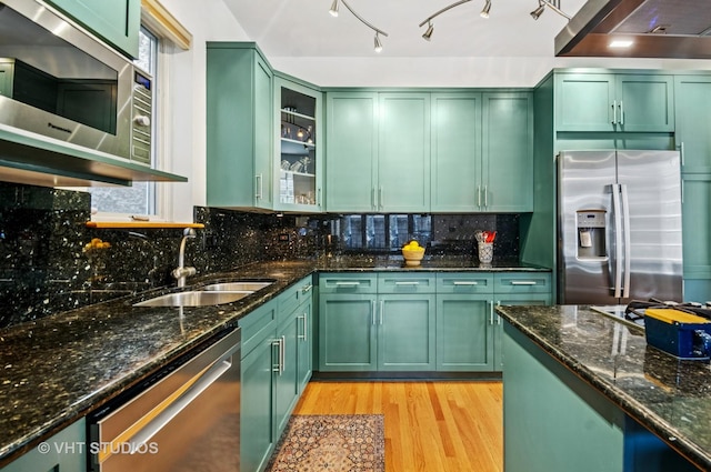 2145 W Crystal St Unit 2, Chicago, IL 60622 - kitchen with green cabinets, stainless steel appliances, light wood-type flooring, and dark stone countertops