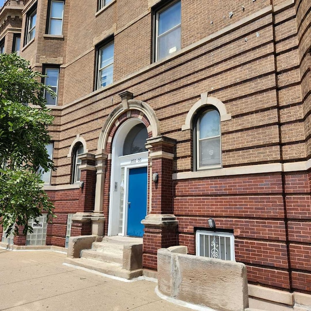 3700 W Cermak Rd Unit 1, Chicago, IL 60623 - doorway to property with brick siding