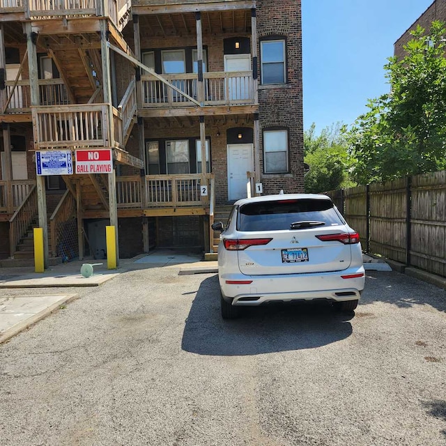 3700 W Cermak Rd Unit 1, Chicago, IL 60623 - view of property with stairway and uncovered parking