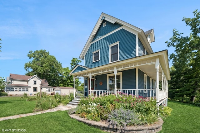 241 Hoy Ave, Woodstock, IL 60098 - view of front of home featuring covered porch and a front yard