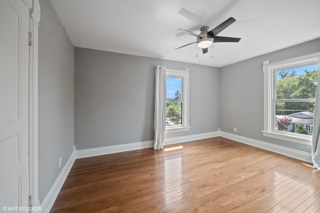 241 Hoy Ave, Woodstock, IL 60098 - empty room with healthy amount of natural light, light wood-type flooring, and a ceiling fan