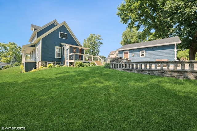 241 Hoy Ave, Woodstock, IL 60098 - rear view of property featuring a lawn and a deck